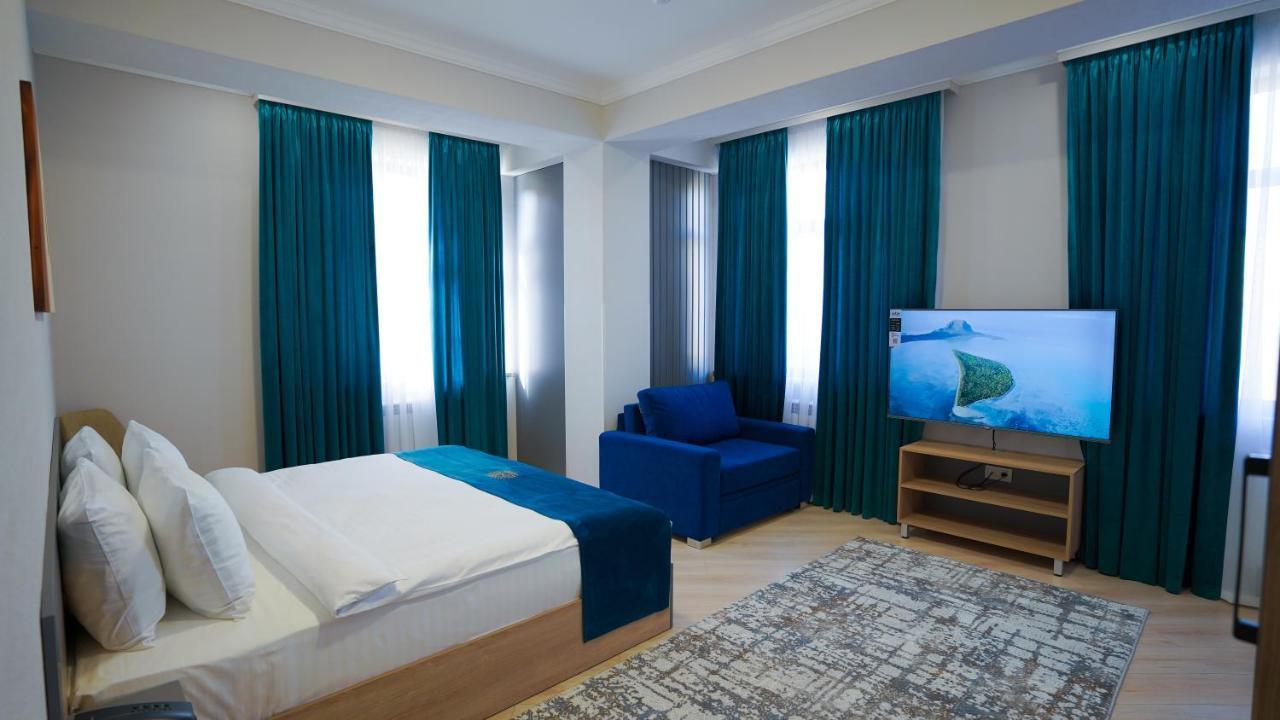 Almalyk Plaza Hotel Olmaliq Buitenkant foto