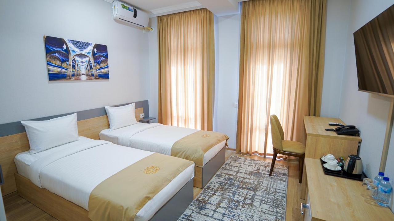 Almalyk Plaza Hotel Olmaliq Buitenkant foto